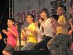 Older children perform together on stage