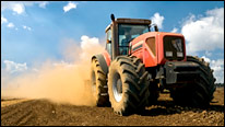 Red tractor in a field