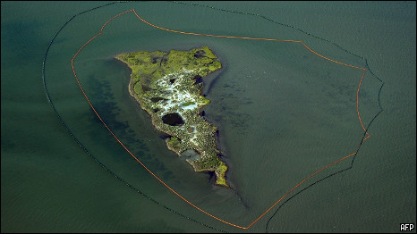 One of the New Harbor Islands is protected by two oil booms against the oil slick, caused by the BP Deepwater Horizon platform disaster off the coast of Lousiana