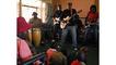 Victor Kunonga (centre) is a regular performer at the Book Cafe. He and his band have been visiting St Giles' School since the start of this year to share their music with the children.