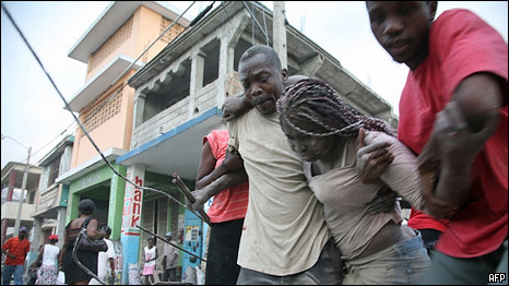 Haitian woman being rescued from rubble after earthquake