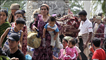 Ethnic Uzbek refugees cross the Kyrgyz-Uzbek border on their way back to Kyrgyzstan outside a village of Nariman on June 17, 2010