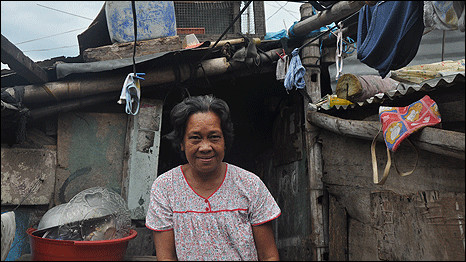 Virginia outside her home in the cemetery where she has lived since 1986