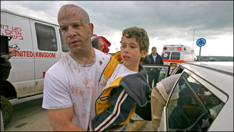 Immediately after the tragic moment, Guy Yuval guides his young family back to safety. 