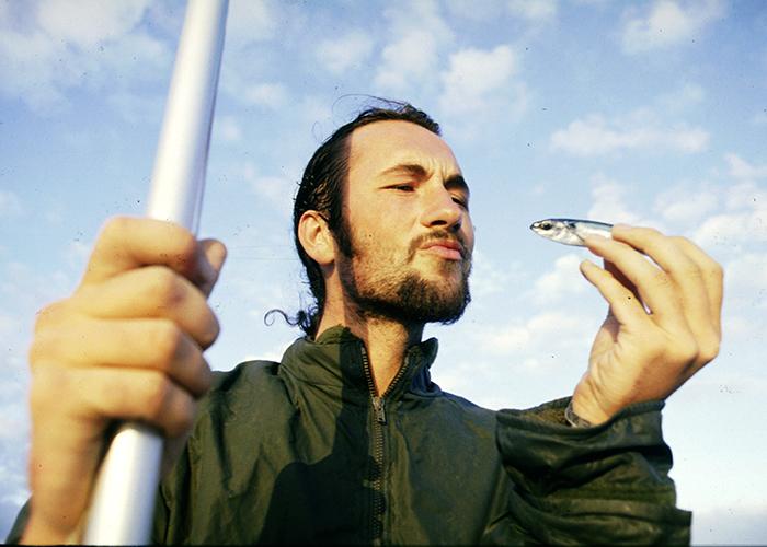 Lewis contemplates a flying fish, 500 miles east of the Caribbean, 1994.