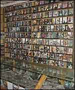 A shop shelf full of porn videos