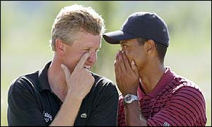 Colin Montgomerie and Tiger Woods share a joke