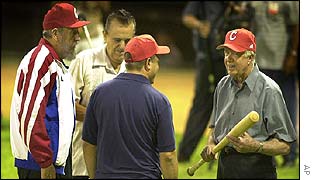 Fidel Castro (left) plays baseball with Jimmy Carter (far right)