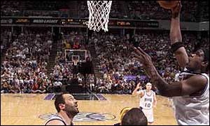Chris Webber of the Sacramento Kings lands a basket against the Lakers