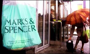 Marks & Spencer shoppers - holding an umbrella