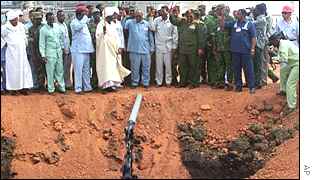 Dignitaries celebrate the opening of an oil well in 1999