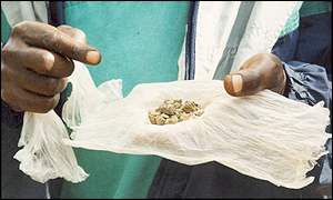 Miner holding coltan