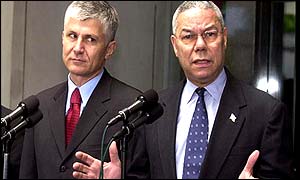 Colin Powell (right) announces decision, beside Serbian PM Zoran Djindjic