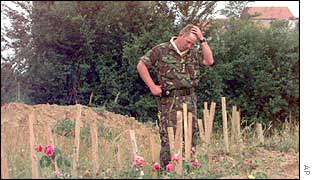 Soldier at site of mass grave in Kosovo