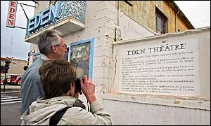 Tourists outside the Eden theatre in France