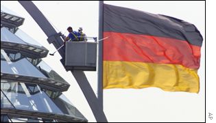 Workers clean the Reichstag roof ahead of Mr Bush's visit