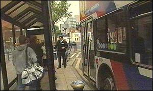 A West Midlands bus picks up passengers