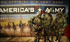 Soldiers stand near the America's Army stand