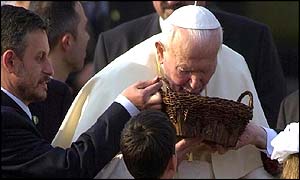 Pope John Paul II kisses Bulgarian soil on arrival in Sofia