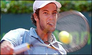 Jose Acasuso plays a back-hand during his straight-sets win against Arnaud Clement,