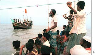 Rescue workers and relatives search for a capsized ferry in the river Megna, Bangladesh