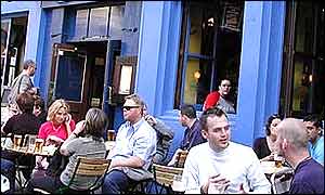 Customers outside a pub