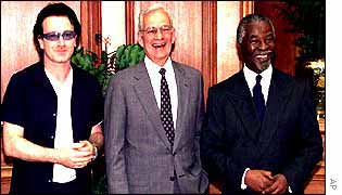 Rock star Bono, left, and US Treasury Secretary Paul O'Neil with South Africa President Thabo Mbeki