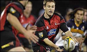 Canterbury Crusaders fly-half Andrew Mehrtens takes on the Brumbies defence