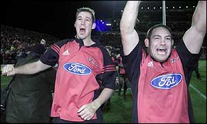 Lock Chris Jack and hooker Mark Hammett celebrate victory