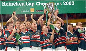 The jubilant Leicester team celebrate with the trophy
