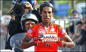 Julio Perez Cuapio celebrates as he crosses the line to win stage 13