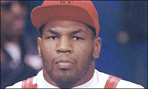 Mike Tyson looking bored at a press conference
