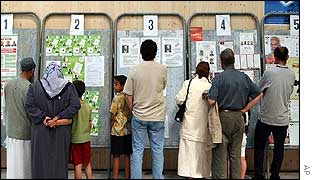 Overseas voters read election posters in Marseille, France