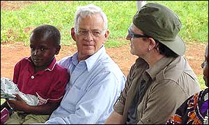 Paul O'Neill and Bono with children at a primary school in Uganda