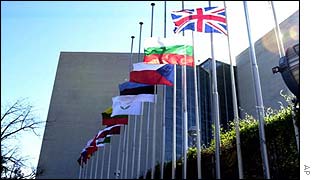 EU flags wave outside a summit meeting