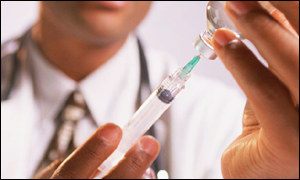 Doctor taking treatment from syringe