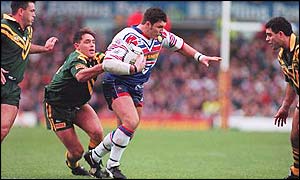 Australia's Brad Fittler tackles Karl Harrison as Mal Meninga (right) and Dean Pay look on