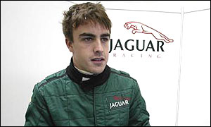 Fernando Alonso in the Jaguar pit at Silverstone