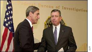 FBI Director Robert Mueller(l) and Attorney General John Ashcroft(r)