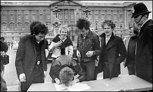 The Sex Pistols sign their record deal with A&M outside Buckingham Palace
