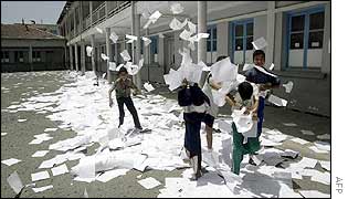 Children playing with cancelled ballot papers