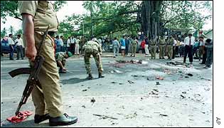 Sri Lankan soldiers check bomb site