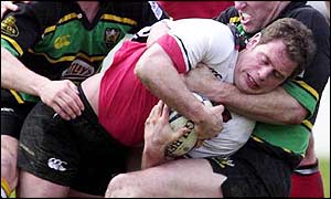 The Northampton pack gets to grips with Kyran Bracken