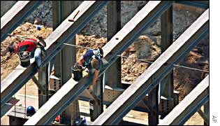 Workers assembling the steel frame of a new mass transit terminal