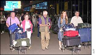 Foreigners leave Delhi's Indira Gandhi International Airport 