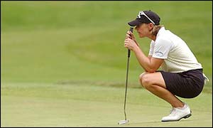 Annika Sorenstam lines up a putt