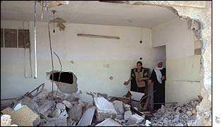 Palestinians survey damage to their home after Israeli attack in Nablus