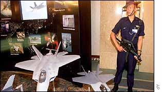 Guard at conference's exhibition stand  