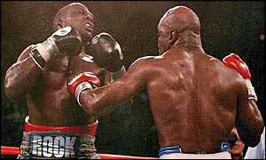 Evander Holyfield lands a big punch on Hasim Rahman