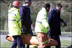 Cronje's body is carried from a rescue helicopter 